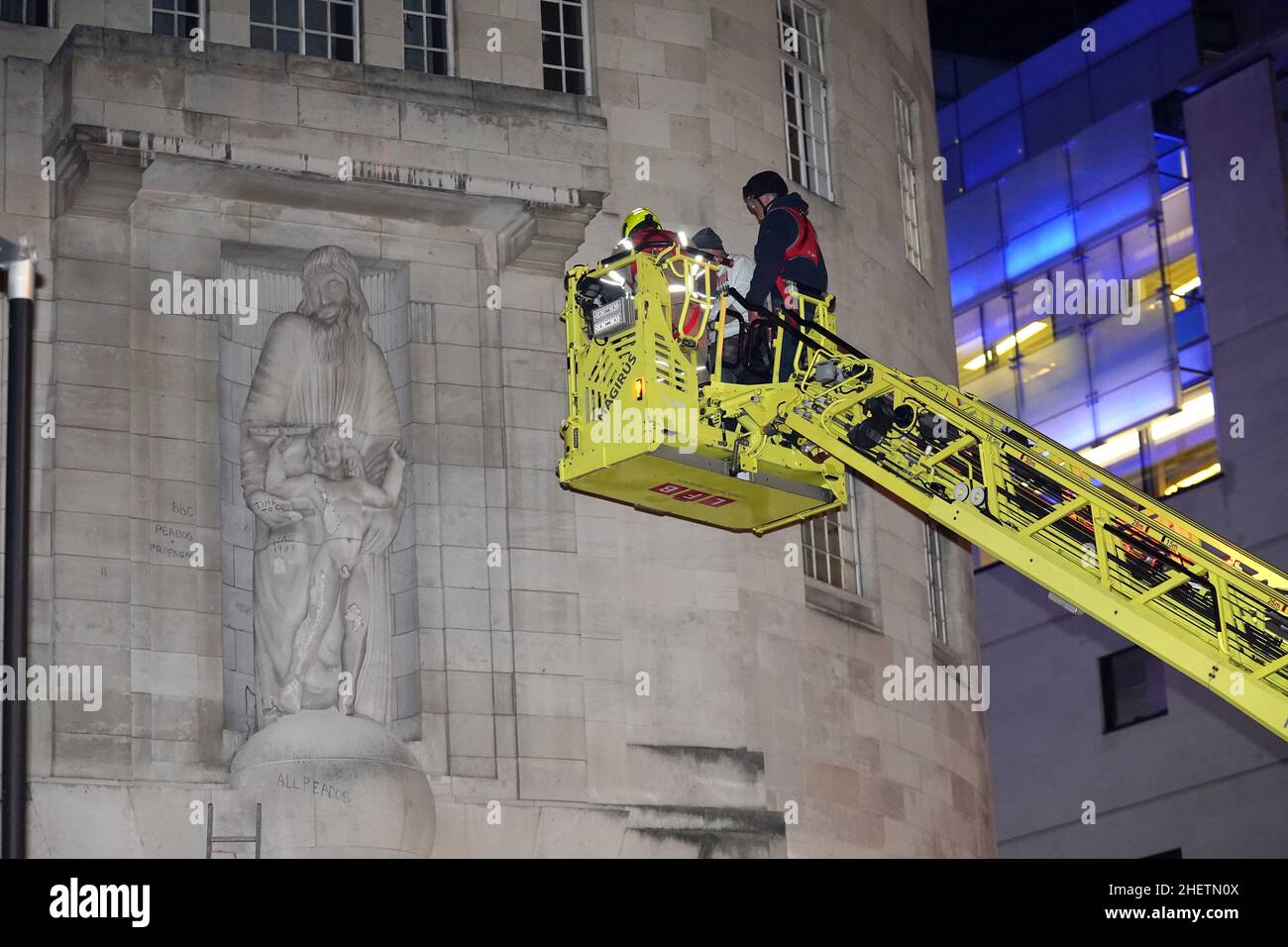 Statue Hoisting A man is taken on firefighters hoist after he climbed onto the statues ...