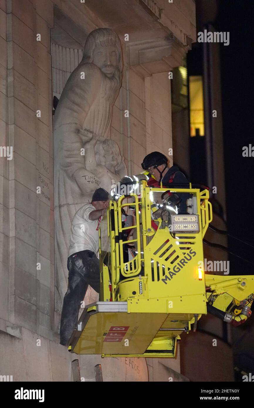 Statue Hoisting A man is taken on firefighters hoist after he climbed onto the statues ...