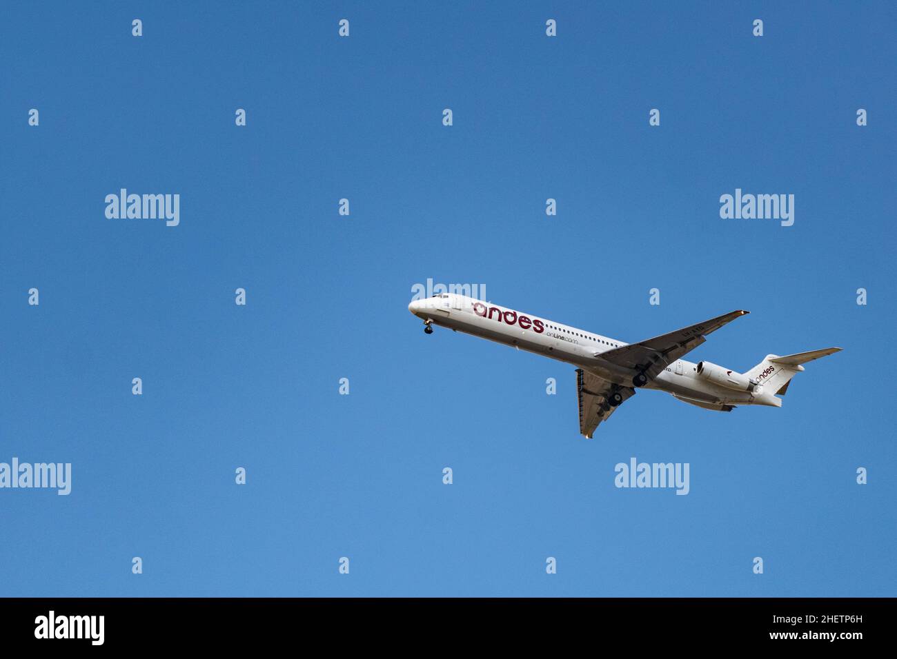 An airplane is seen flying Stock Photo