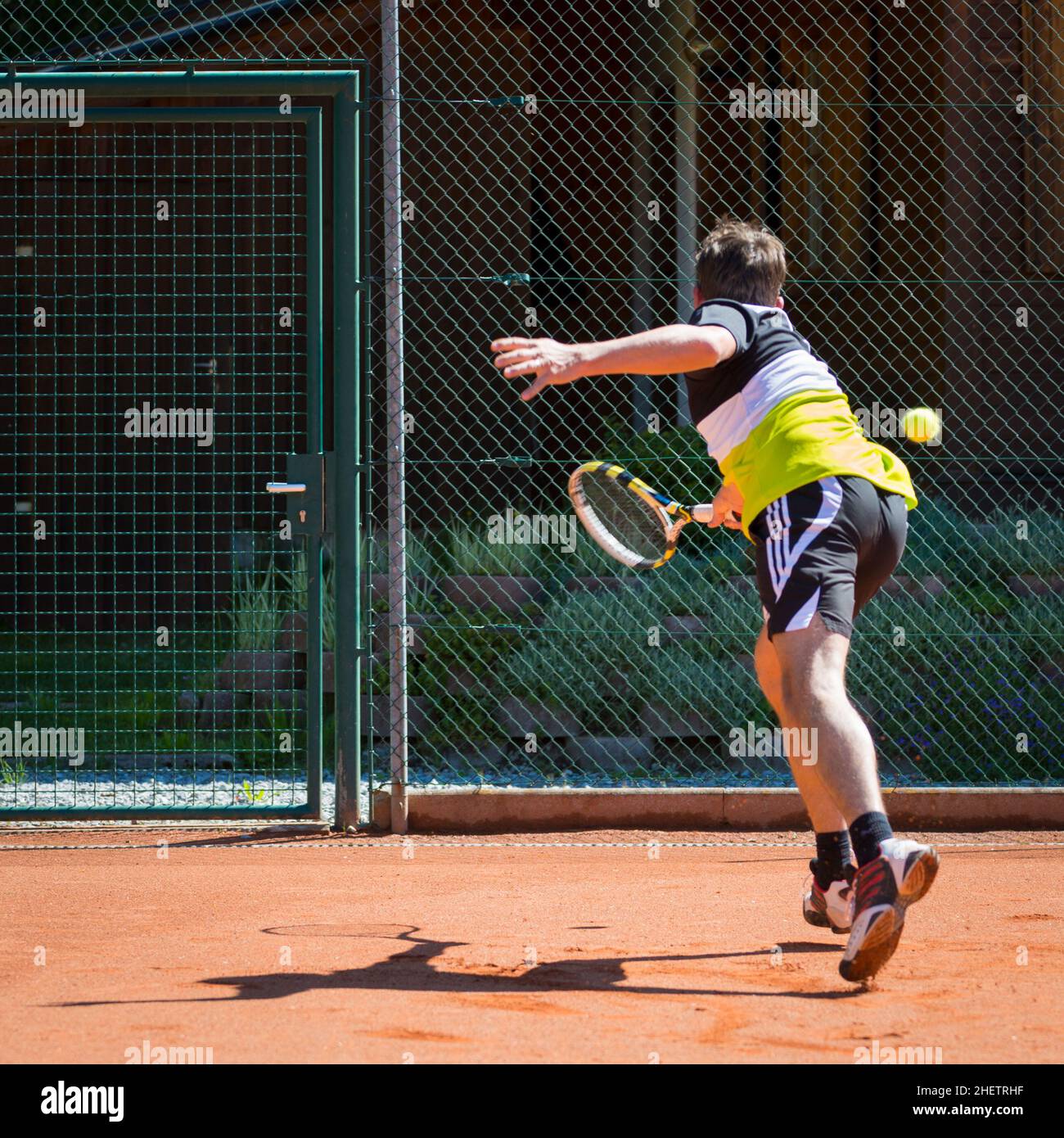 defense action of tennis player on sand court Stock Photo Alamy