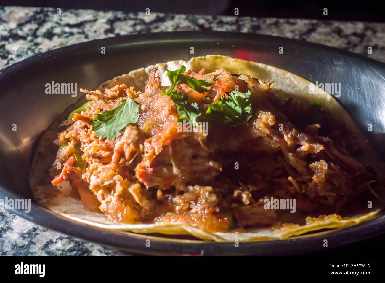 Mexican taco made with brisket, guacamole and vinaigrette Stock Photo