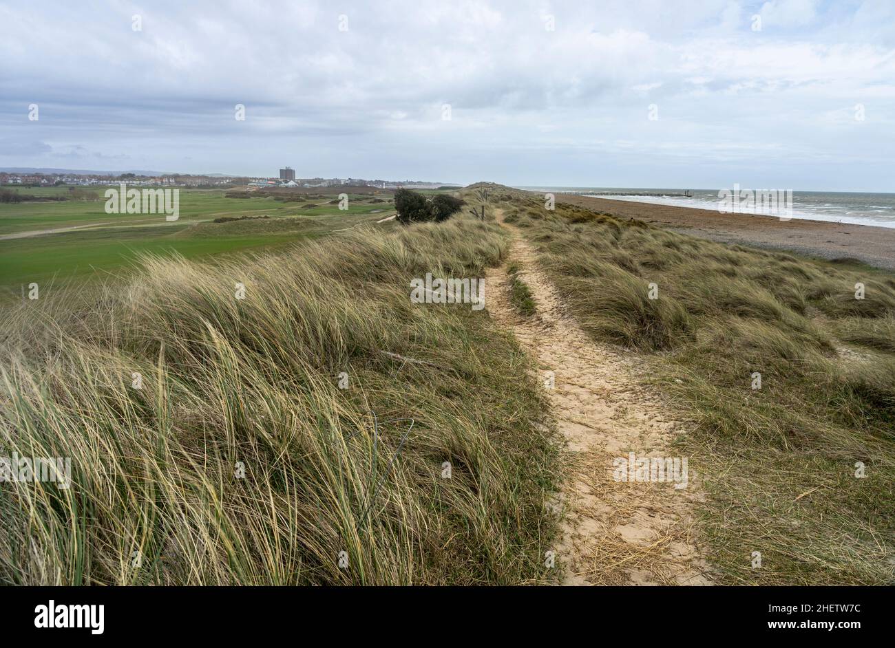 Path along sand dunes behind shingle beach Stock Photo