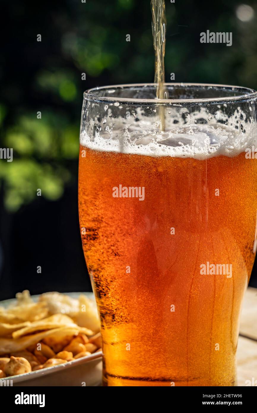 Pouring a drink on a summer's day Stock Photo