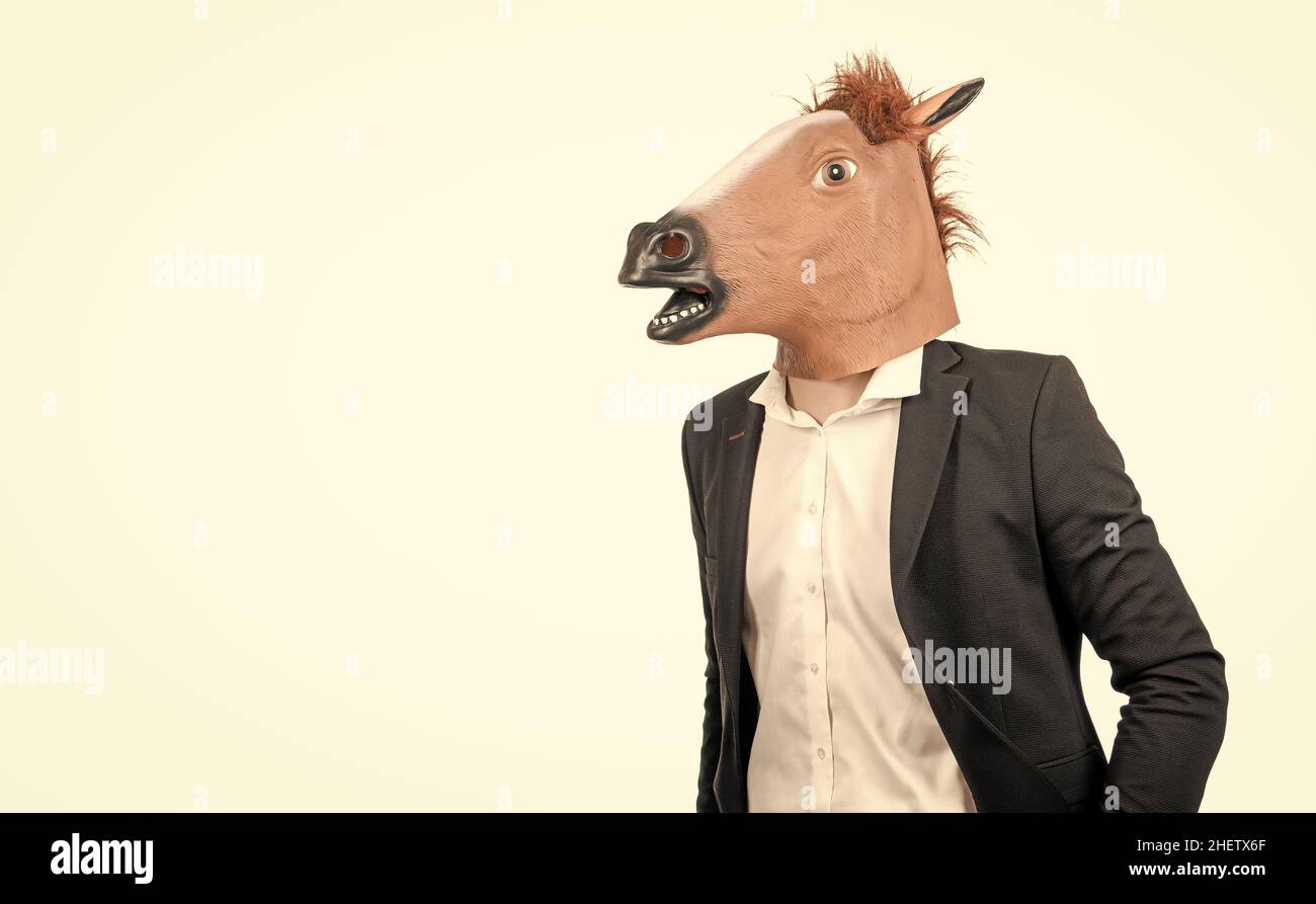 Hardworking employee. Employee in horse head mask. Professional man as