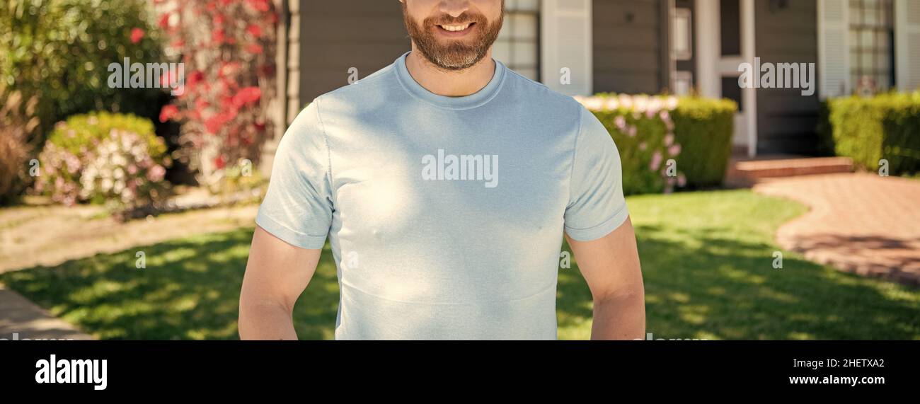 cropped man standing on background of house, ownership Stock Photo