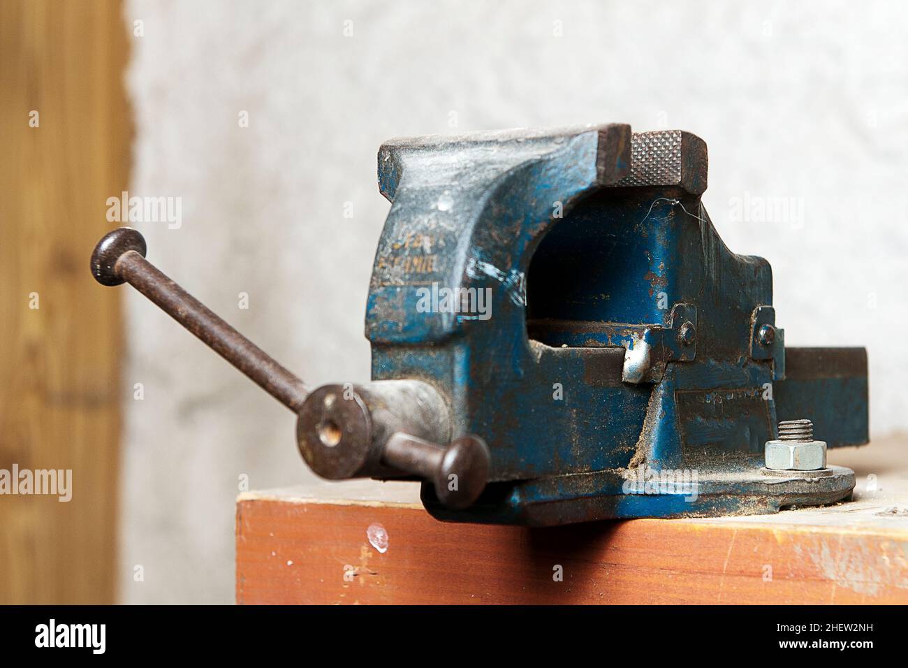 blue metal bench vise on a work bench Stock Photo Alamy