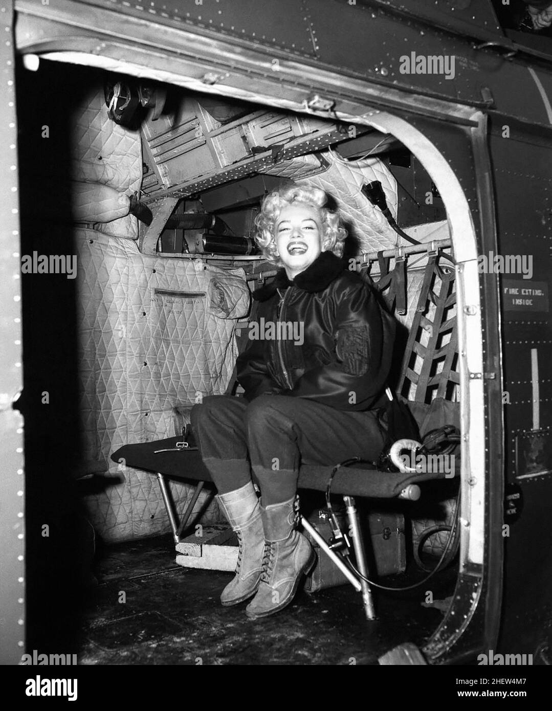 Marilyn Monroe in a helicopter, visiting the troops in Korea, february, 1954. Stock Photo