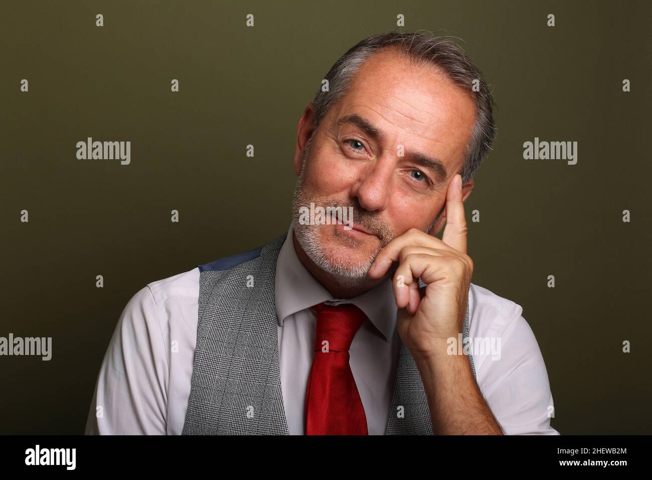 Portrait of a beautiful happy man in front of a colored background Stock Photo