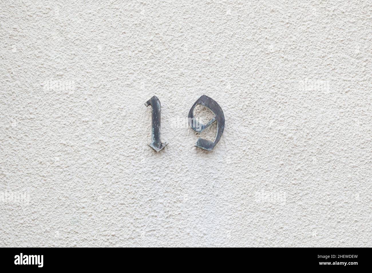 house number 19 at the wall for postal adress Stock Photo - Alamy