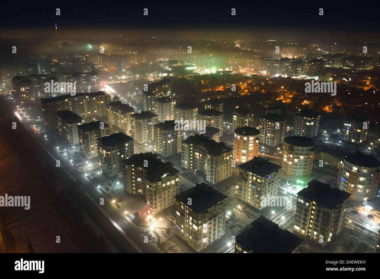 Aerial view of high rise apartment buildings and bright illuminated ...