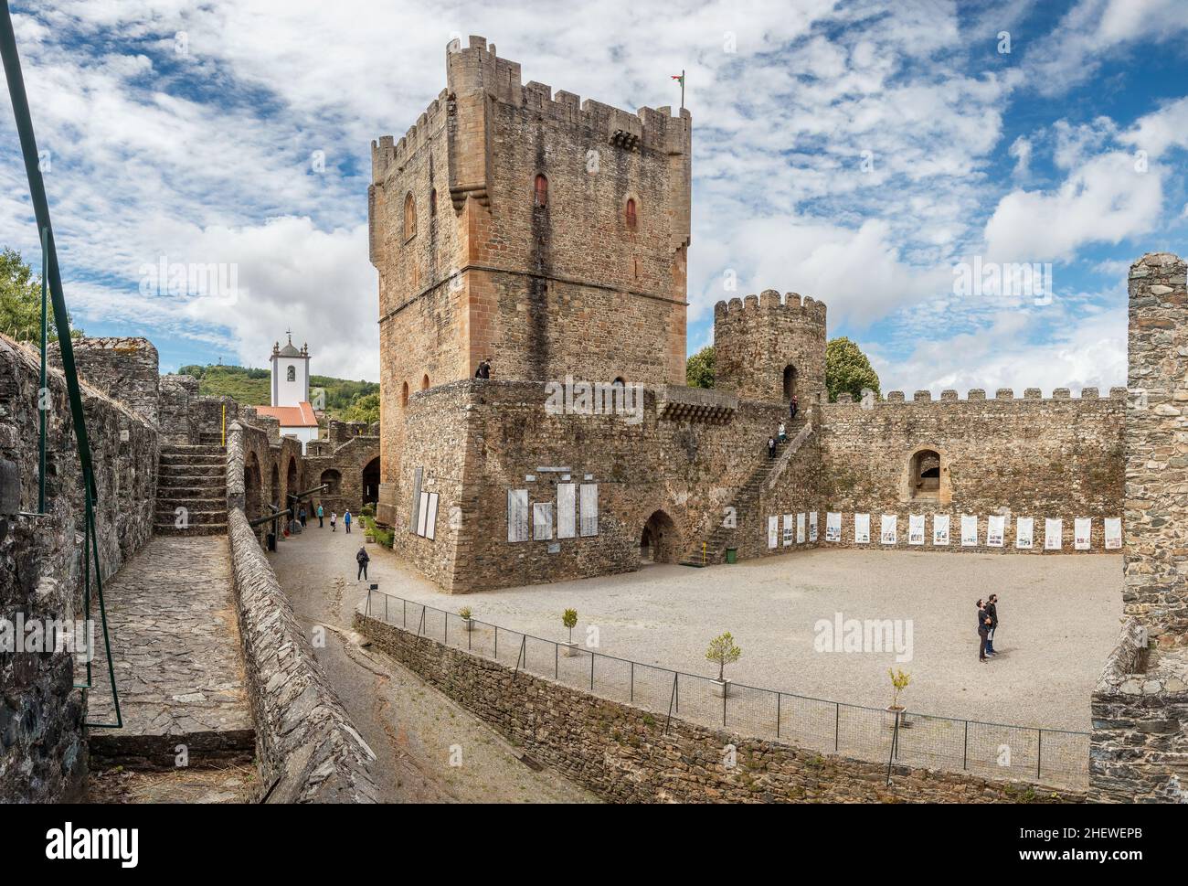 Bragança, Portugal - June 27, 2021: View of the keep and the inner courtyard of the Bragança castle in Portugal, with a cloudy sky in the background. Stock Photo