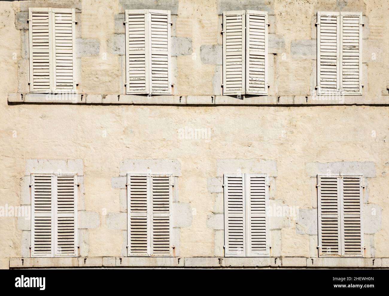 old house facade with eight closed shutters in white Stock Photo - Alamy
