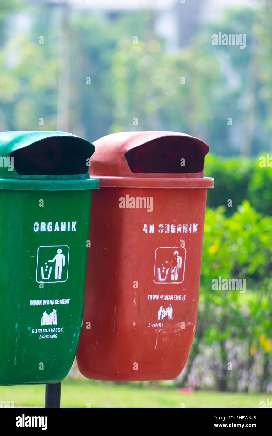Eco Friendly plastic garbage or trash bin on public city park Stock
