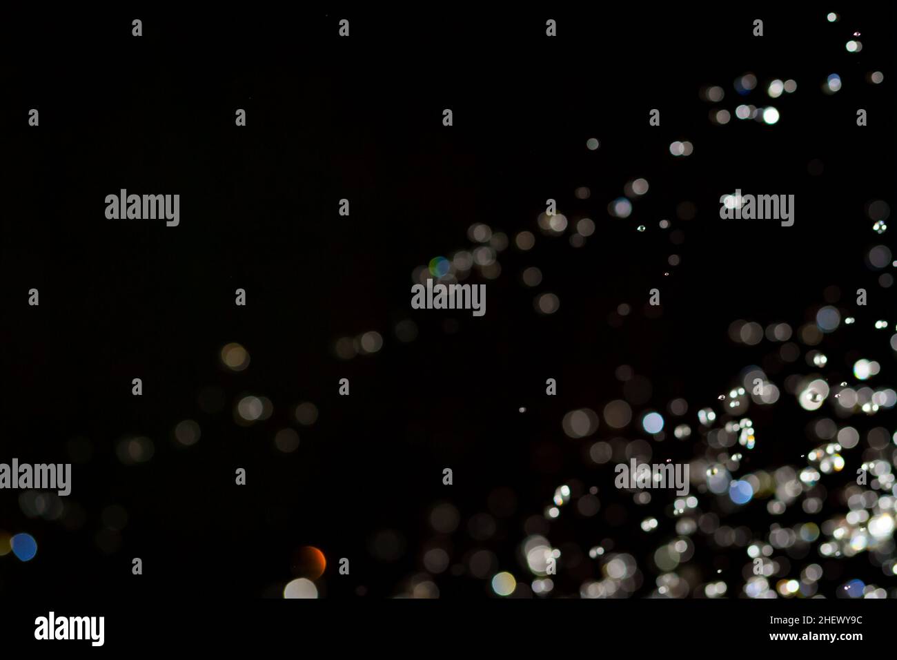 Abstract bokeh texture on black background Stock Photo - Alamy