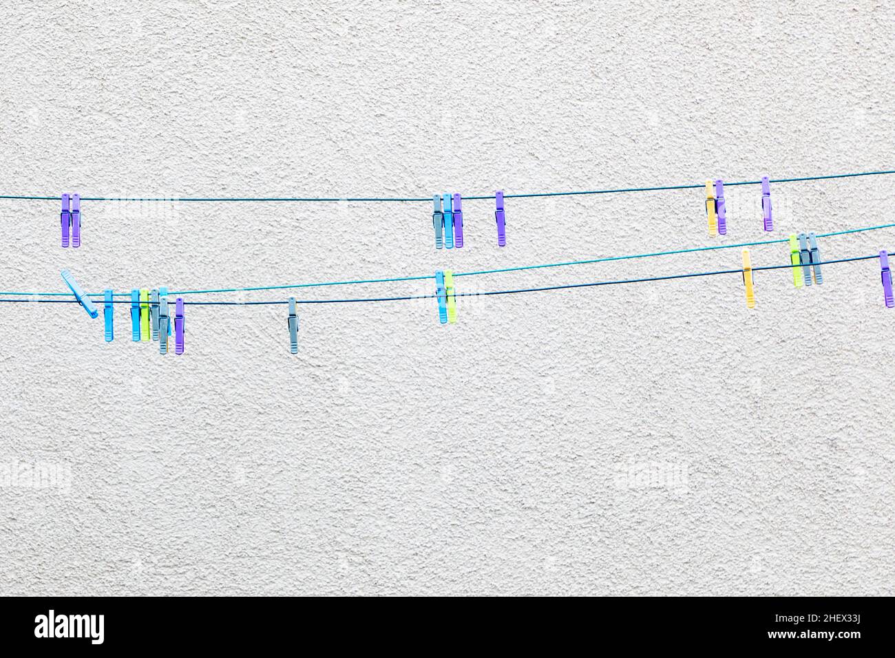 collection of colorful clothes pegs on white background Stock Photo - Alamy