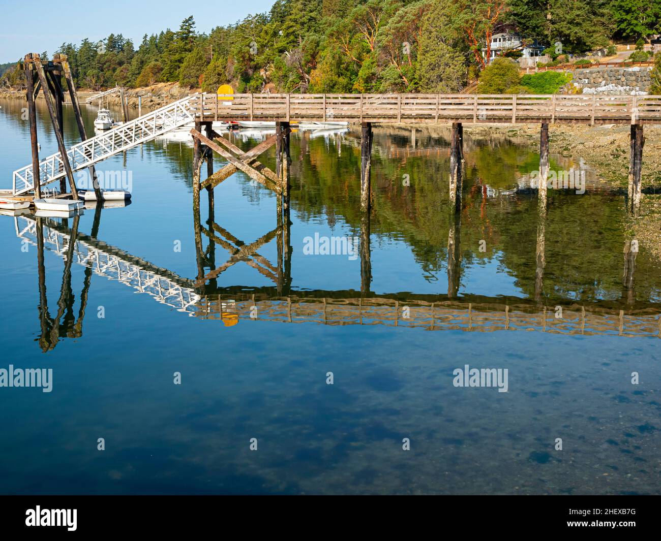 WA21082-00...WASHINGTON - Perfect reflection in the calm waters of West Sound on Orcas Island. Stock Photo