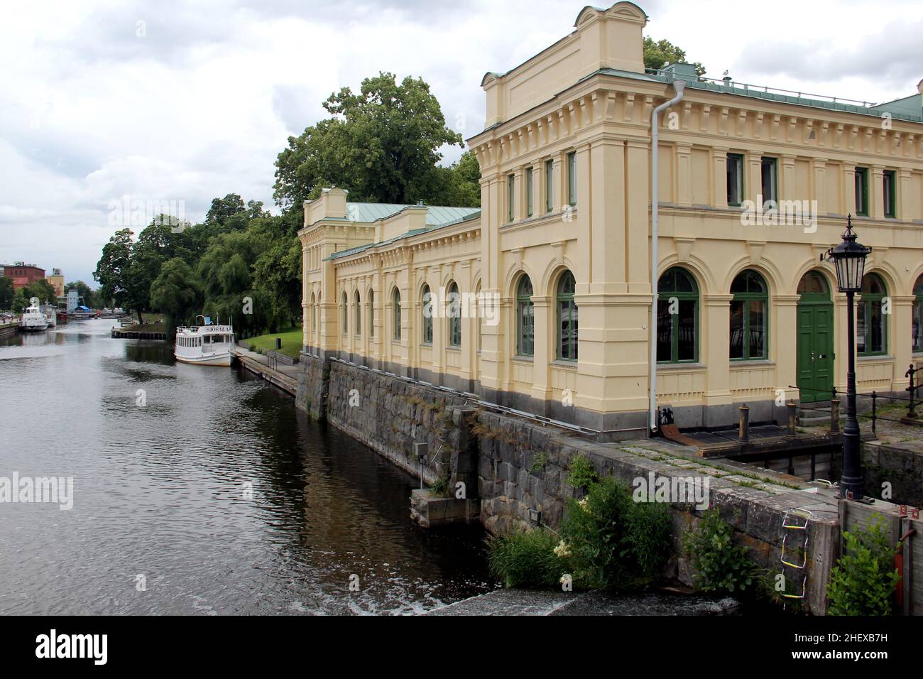 Historic Water-pump Building on the Fyris River embankment, Uppsala, Sweden Stock Photo