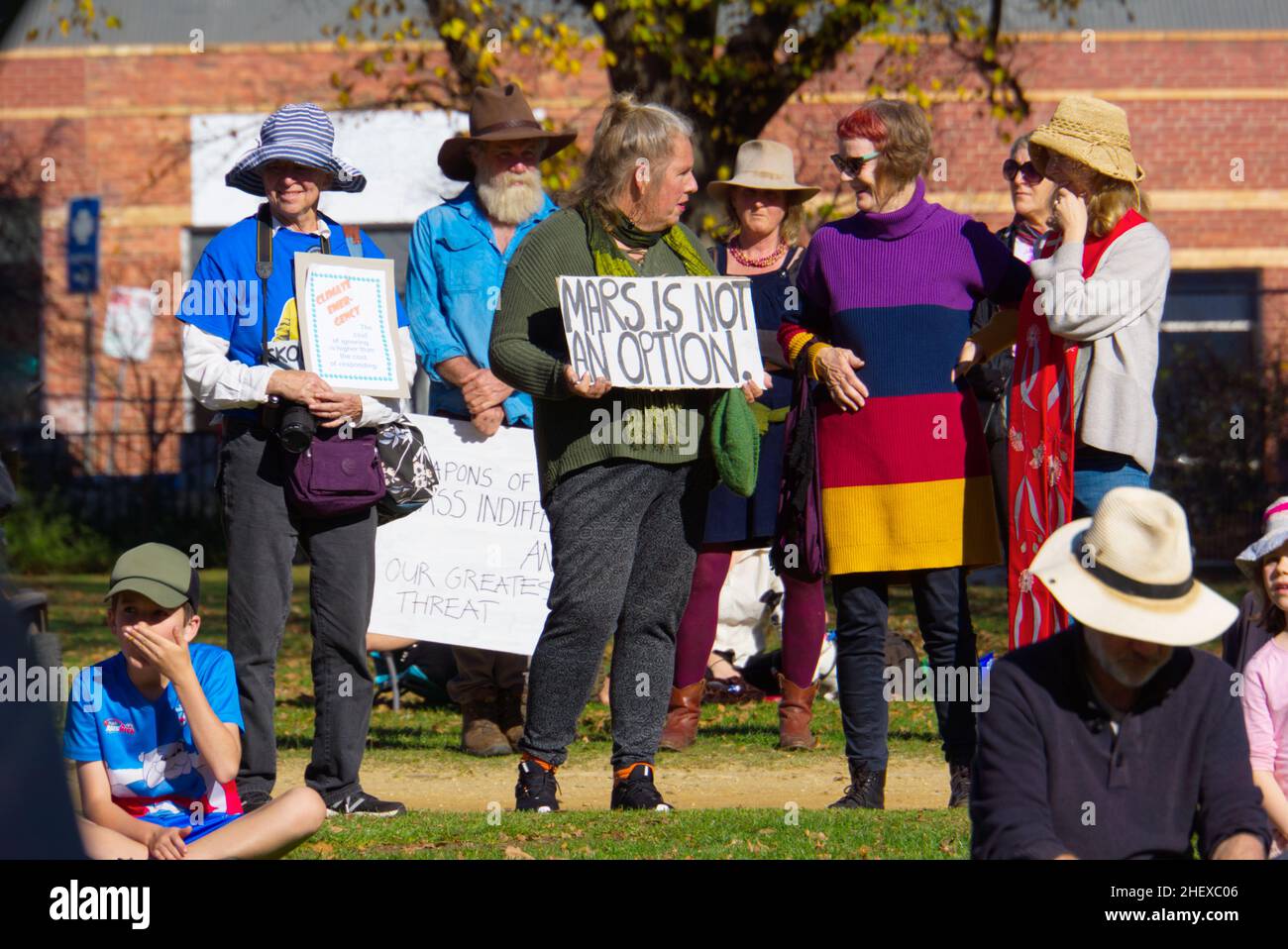 Climate change protest sign and people demonstration rally for saving the environment, Castlemaine, Victoria, Australia. Stock Photo