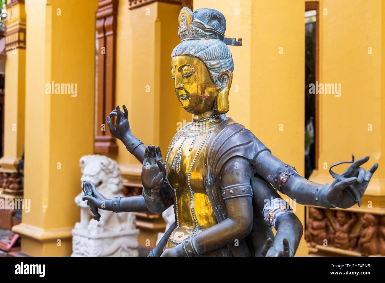 Decoration of Buddhist temple. Ancient statue of Guanyin, Guan Yin or Kuan Yin. It is the Buddhist bodhisattva associated with compassion Stock Photo