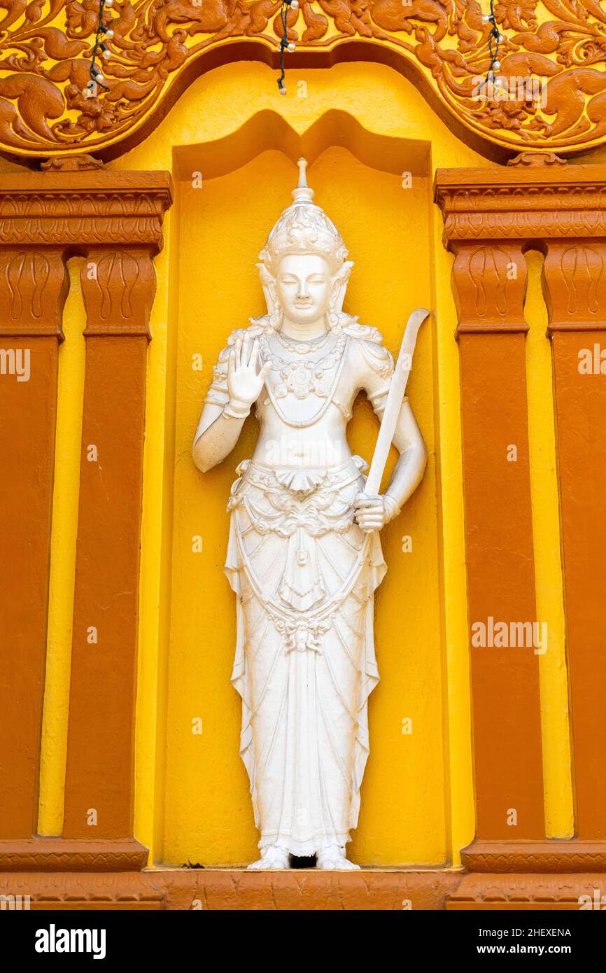 White statue at Gangaramaya Temple, it is one of the most important temples in Colombo, Sri Lanka Stock Photo