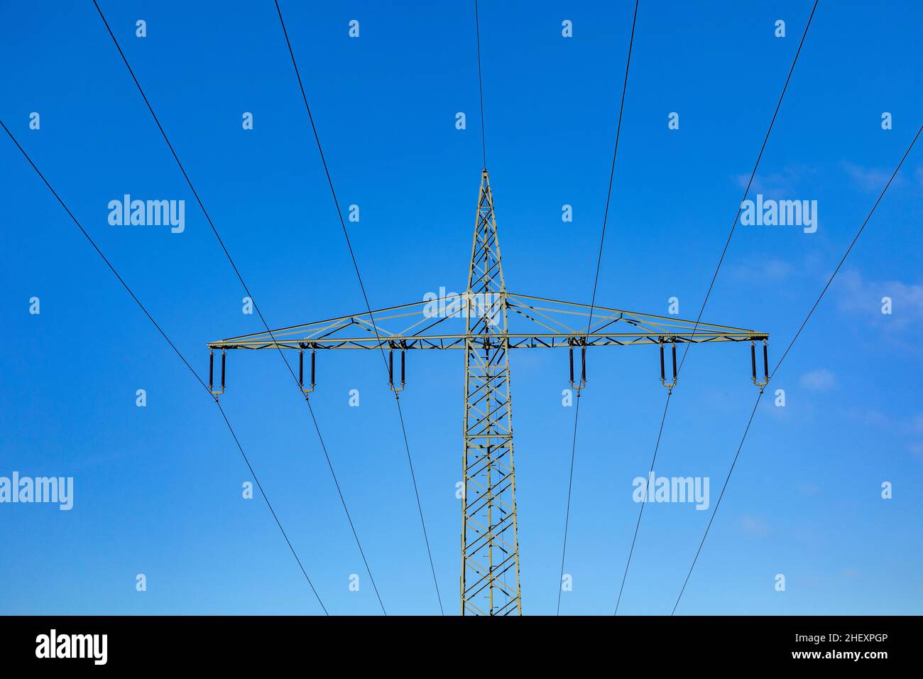 electric pylon under clear blue sky Stock Photo - Alamy