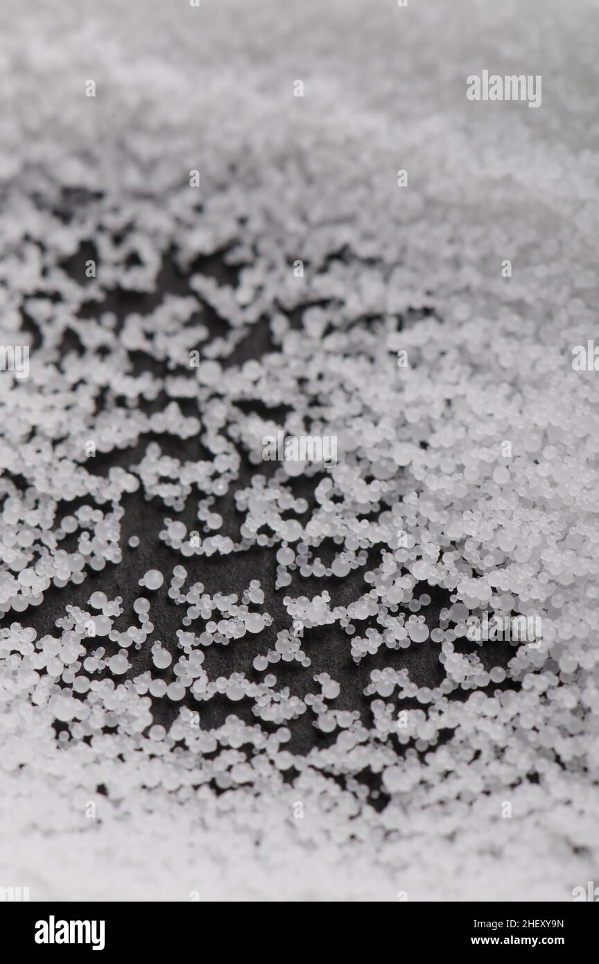 Plastic grey balls granules from polymer chemical industry Stock Photo