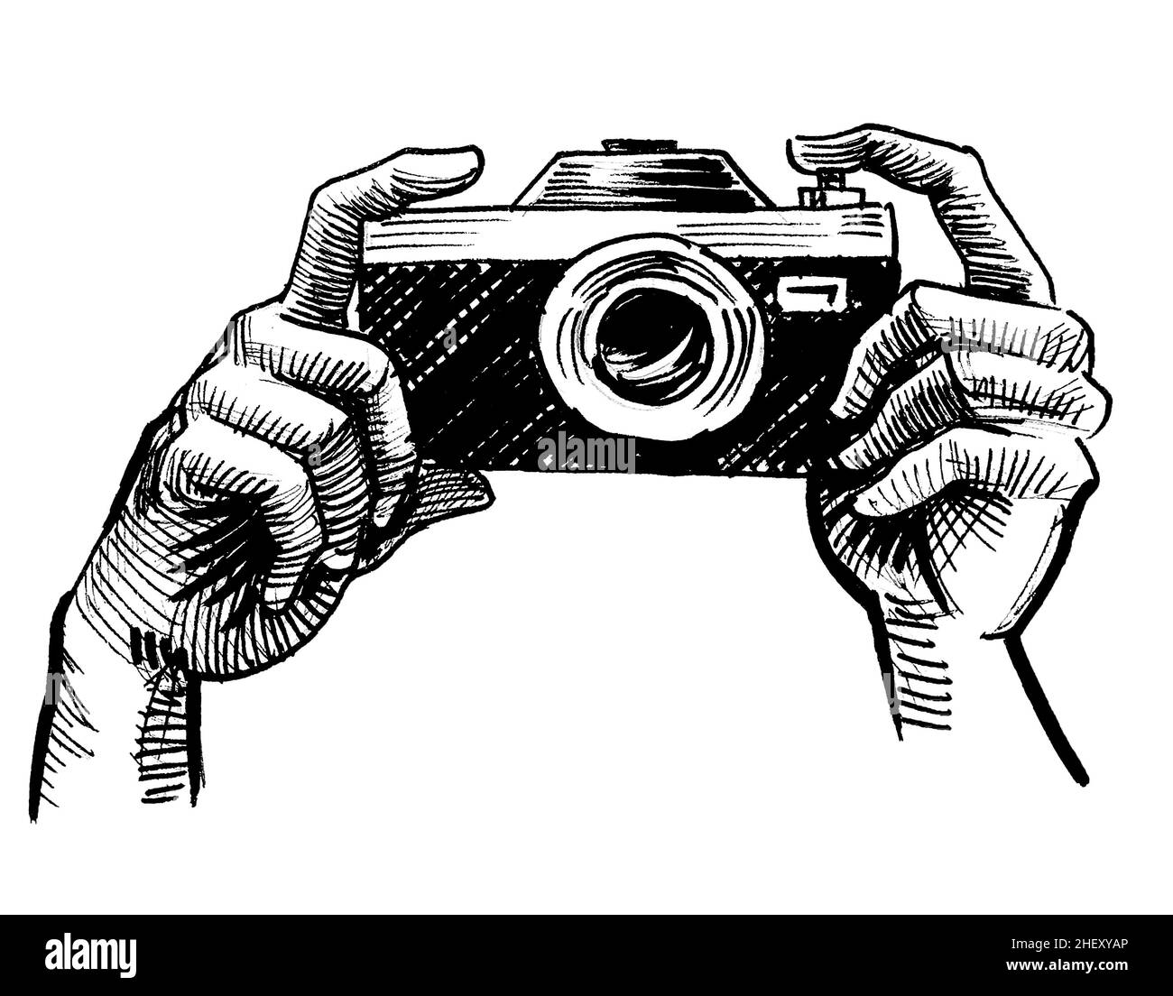 Hands holding vintage analog camera. Ink black and white drawing Stock Photo
