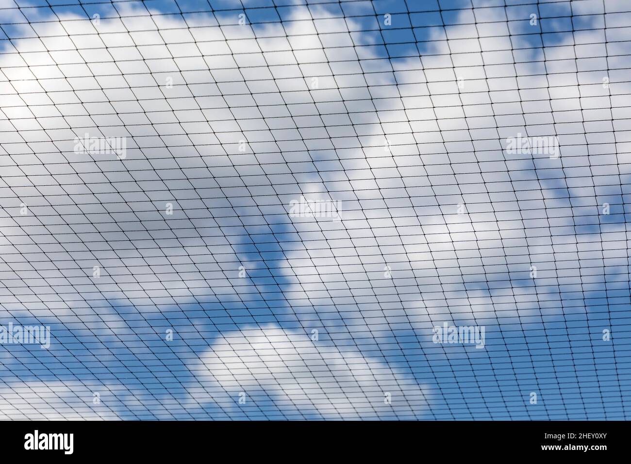 Metal Net Blue metal net with blue sky gives a harmonic background Stock Photo - Alamy