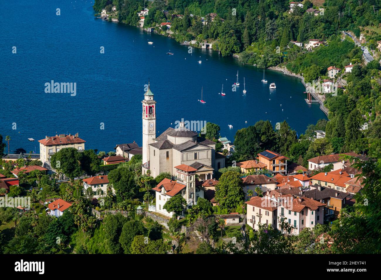 Aerial view on the roofs of Cannero, the church Chiesa Parrocchiale di San Giorgio and Lake Maggiore. Stock Photo