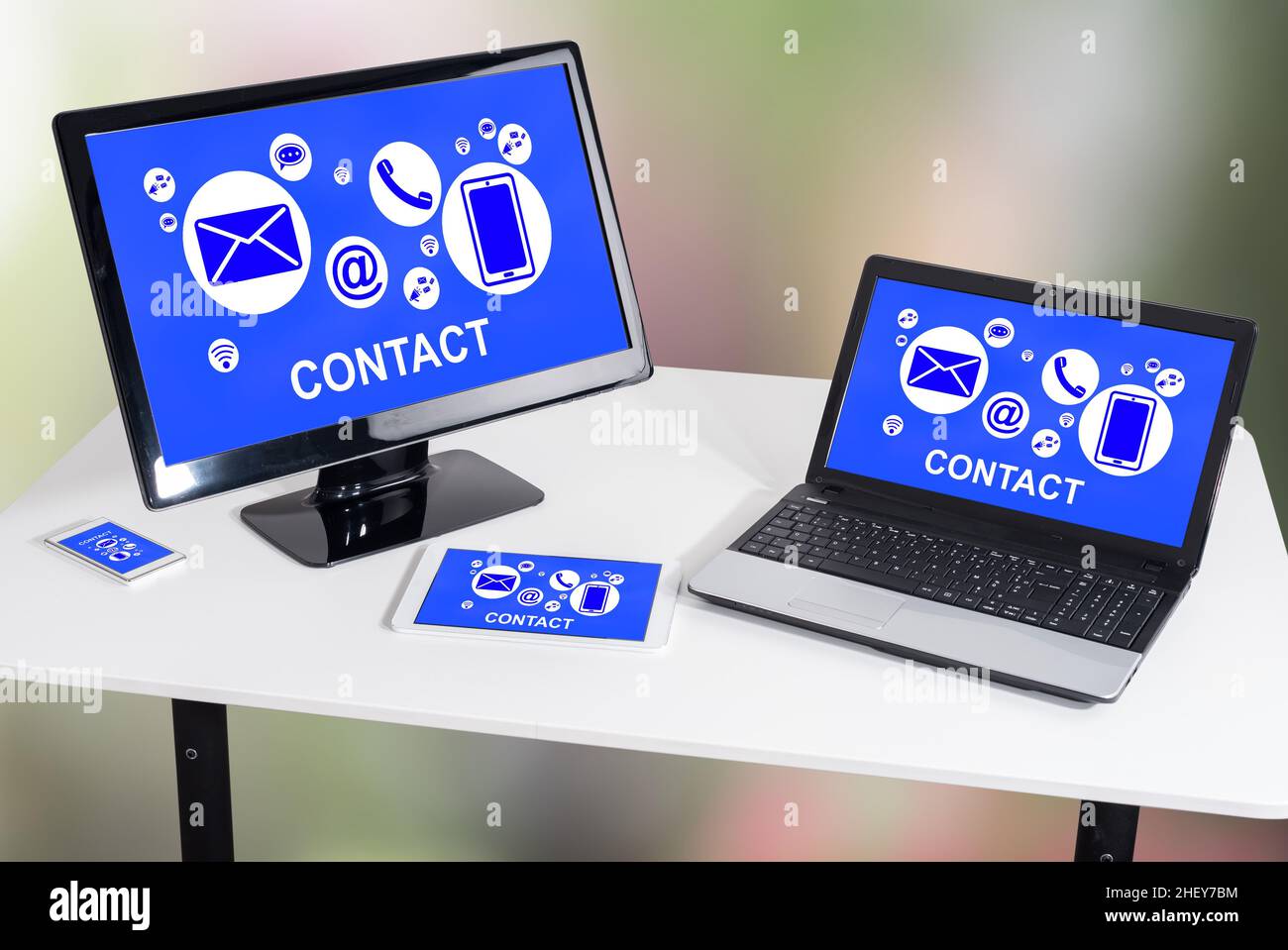 Contact concept shown on different information technology devices Stock Photo