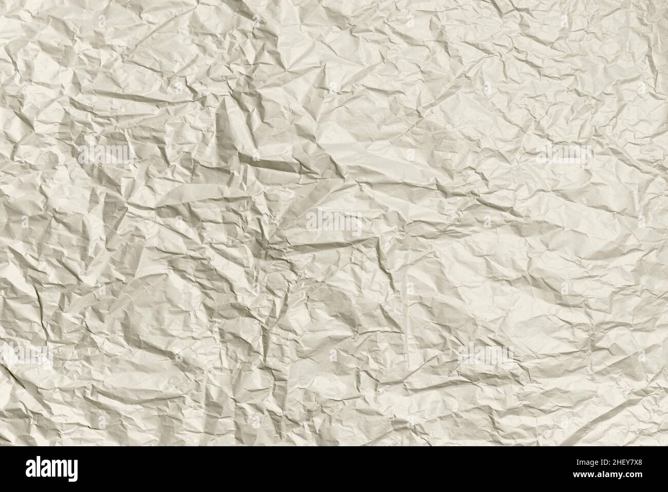 Crumpled paper ivory color texture. Abstract background. Mockup for