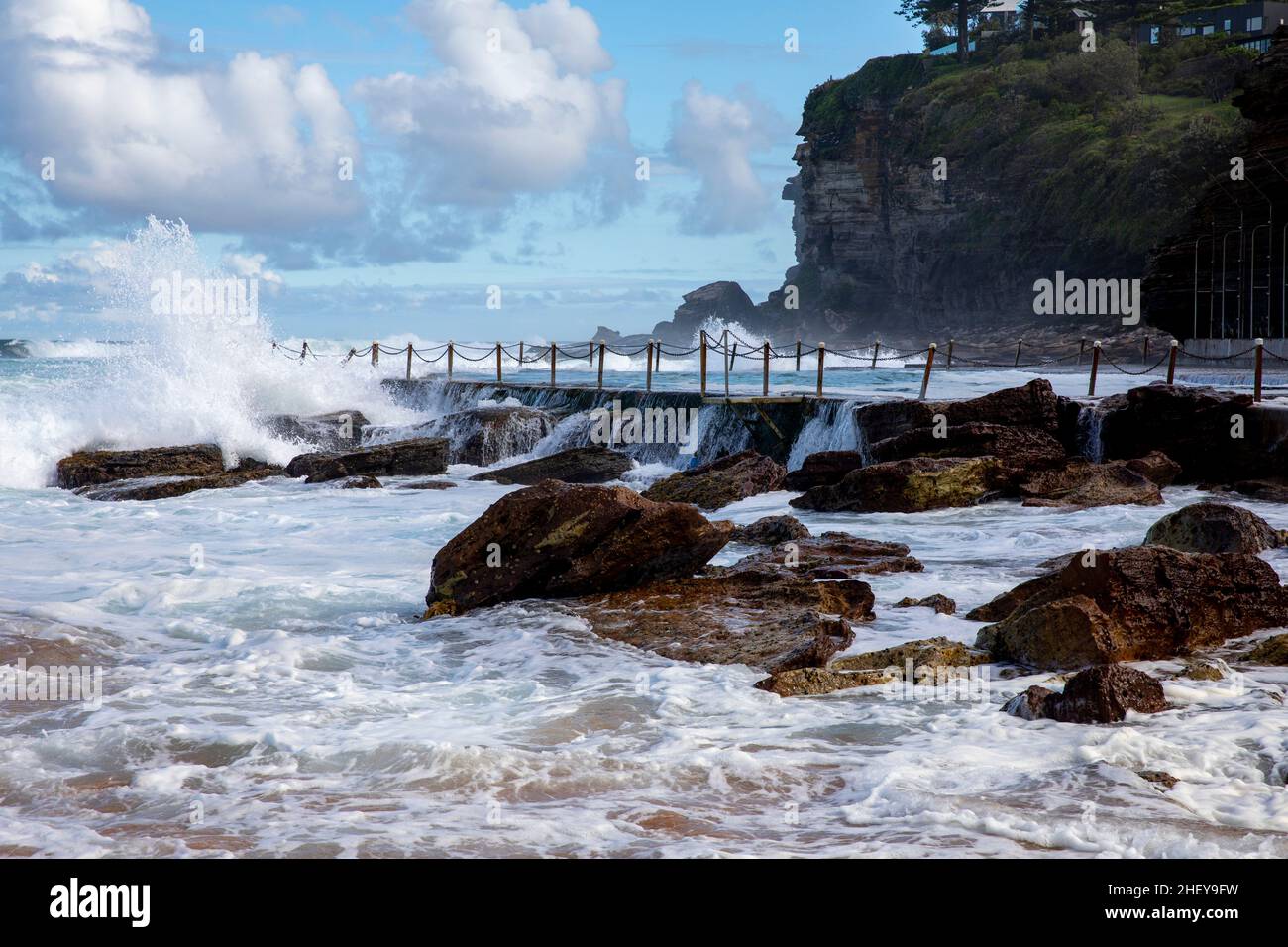 Summer at Avalon Beach in Sydney, huge surf and big waves crash into