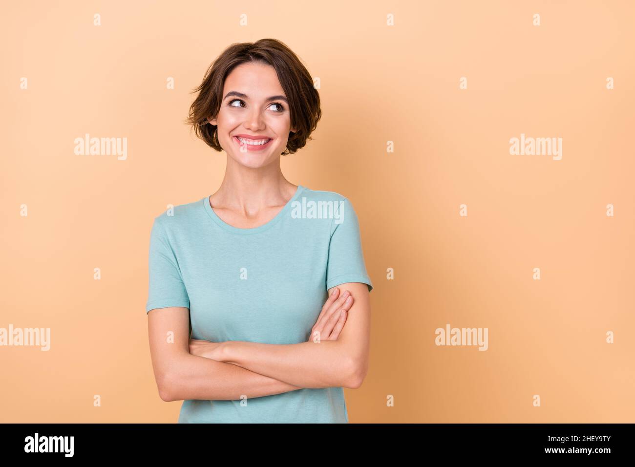 Photo of young pretty girl crossed hands look empty space curious dream ...