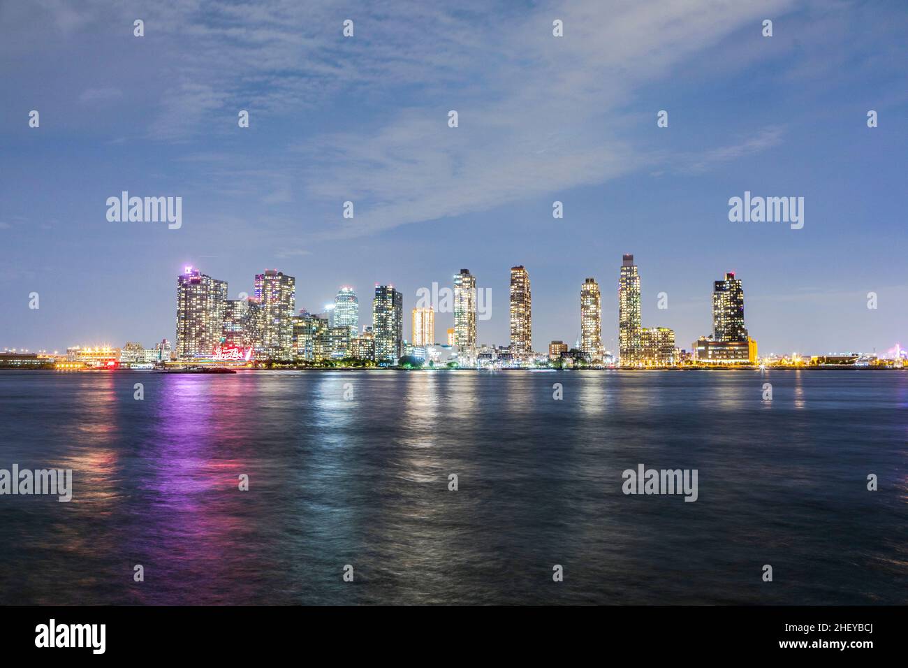 panoramic view to New York by night with Hudson river Stock Photo - Alamy
