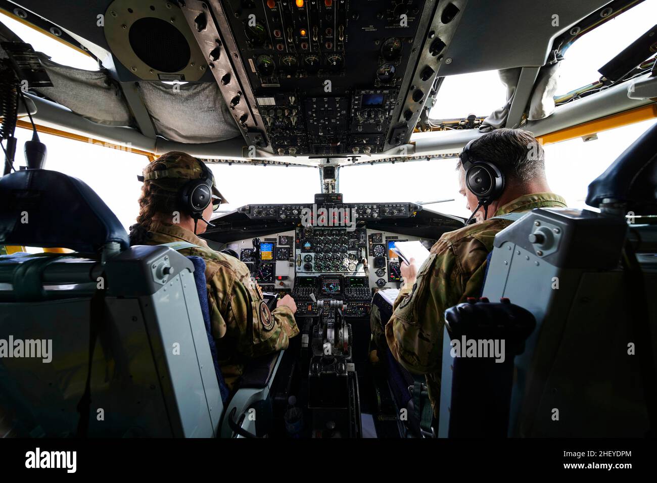 Al Udeid Air Base, USA. 1st Jan, 2022. U.S. Air Force Capt. Kristie Ciampa-Mangers (left) and Lt. Col. Cory Clagett (right), KC-135 Stratotanker pilots assigned to the 50th Expeditionary Air Refueling Squadron, conducts preflight checks on a U.S. Air Force KC-135 Stratotanker before a refueling mission at Al Udeid Air Base, Qatar, Jan. 1, 2022. The KC-135 delivers U.S. Air Forces Central a global reach aerial refueling capability to support joint and partner nation aircraft throughout the U.S. Central Command area of responsibility. (photo by Christopher Ruano) (Credit Image: © U.S. Air Fo Stock Photo