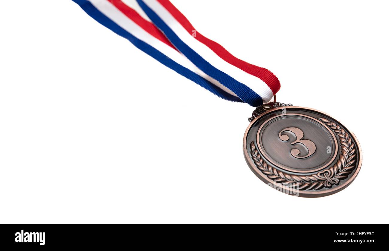 Bronze medal, third place. Champion trophy award and red blue ribbon, design element. Prize in sport isolated cutout on white background Stock Photo