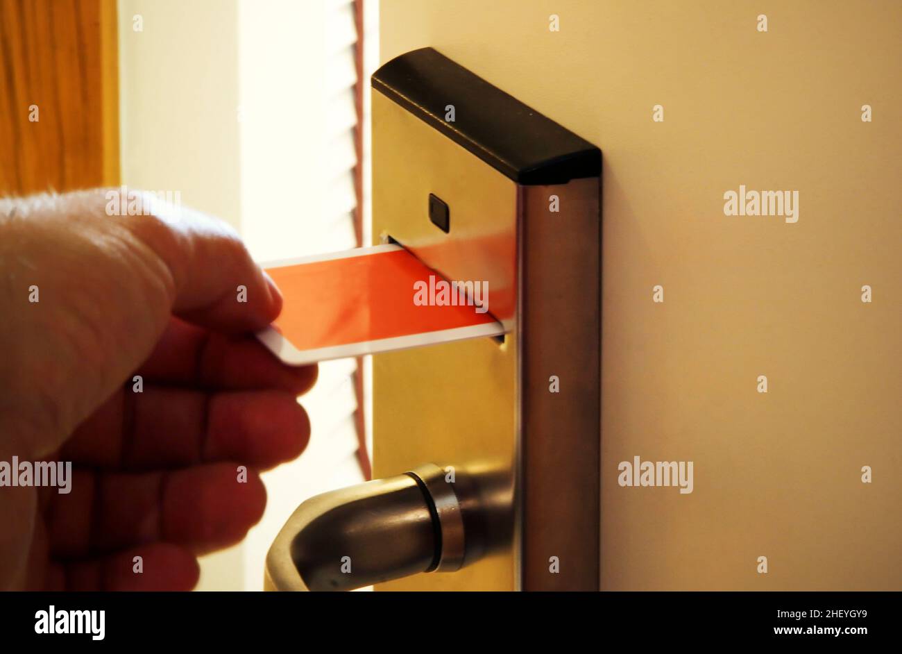 Person Unlocking Keycard Door Lock Stock Photo