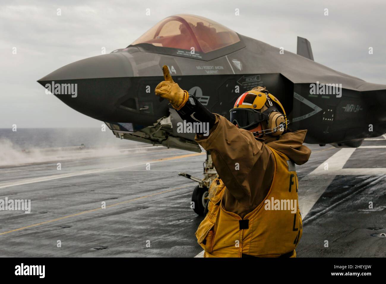 Usa. 8th Jan, 2022. Senior Chief Aviation Boatswain's Mate (Handling) 2nd Class Wilmarie Torres, from Orocovis, Puerto Rico directs an F-35C Lightning II, assigned to the 'Black Knights' of Marine Fighter Attack Squadron (VMFA) 314, on the flight deck of USS Abraham Lincoln (CVN 72). The Abraham Lincoln Carrier Strike Group, led by Carrier Strike Group 3, deployed from San Diego, Jan. 3, in support of global maritime security operations. An integral part of U.S. Pacific Fleet, U.S. 3rd Fleet operates naval forces in the Indo-Pacific and provides the realistic, relevant training necessary t Stock Photo
