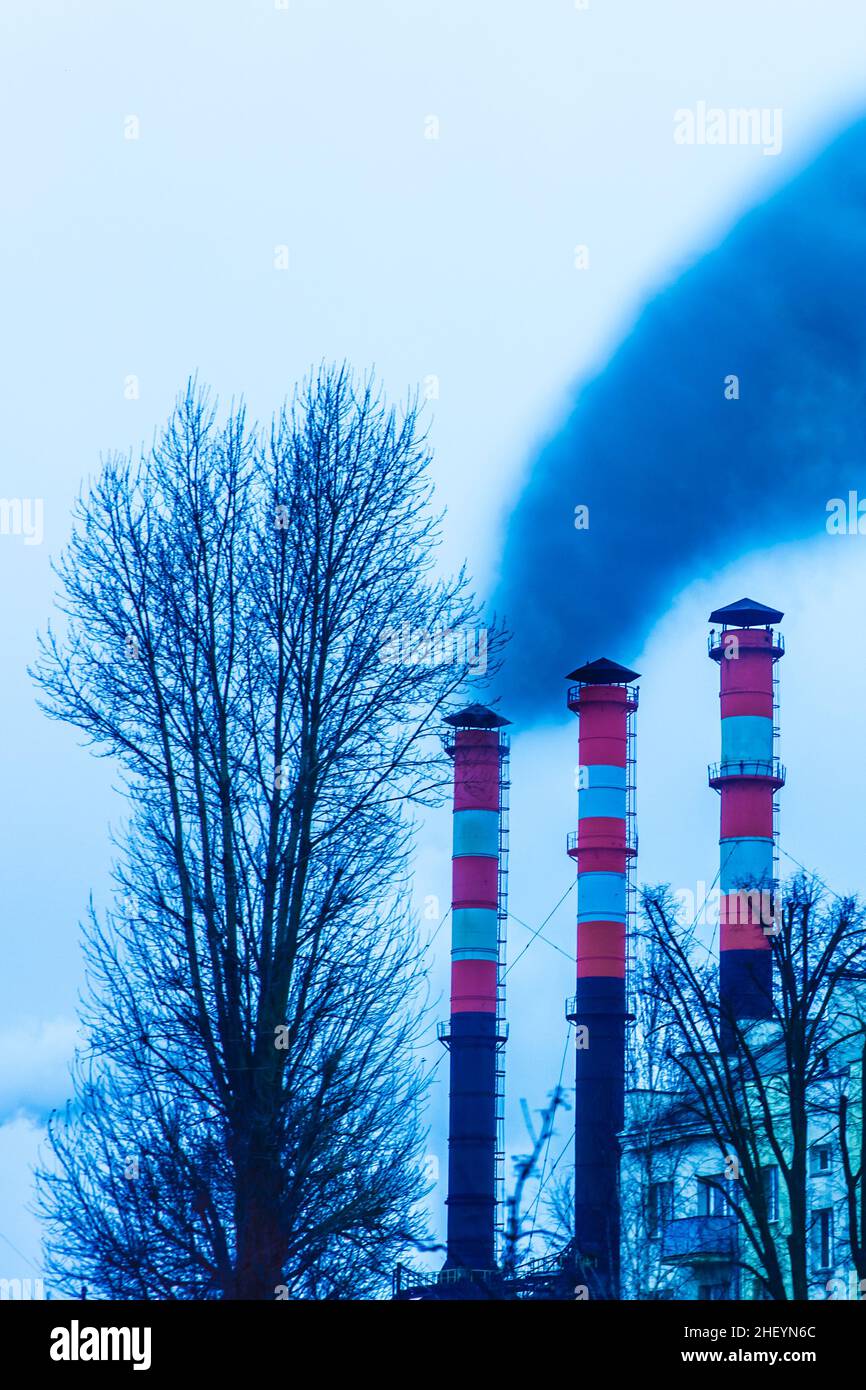 Pollution of the environment, air and ecology are global problems. Toxic smoke from the dirty chimney of an industrial plant is released into the atmo Stock Photo