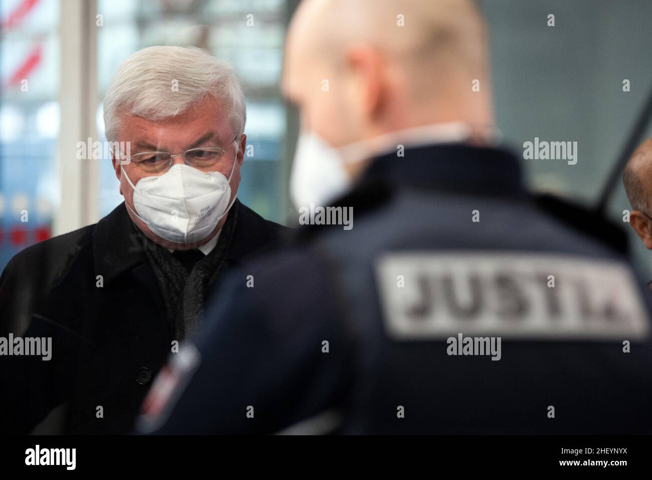 Cologne, Germany. 13th Jan, 2022. Günter Assenmacher, former church judge of the Archdiocese of Cologne, waits at the security desk of the regional court. Assenmacher is to testify as a witness in an abuse trial. The defendant before the Cologne Regional Court is a Catholic priest who is alleged to have abused his three nieces as children in Gummersbach in the 1990s. Credit: Federico Gambarini/dpa/Alamy Live News Stock Photo