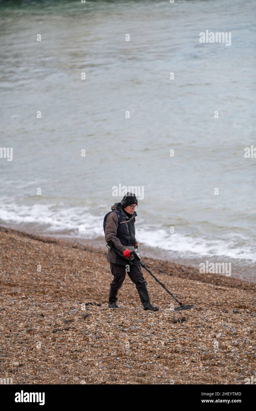 Hobby deterctorist with metal detector hires stock photography and