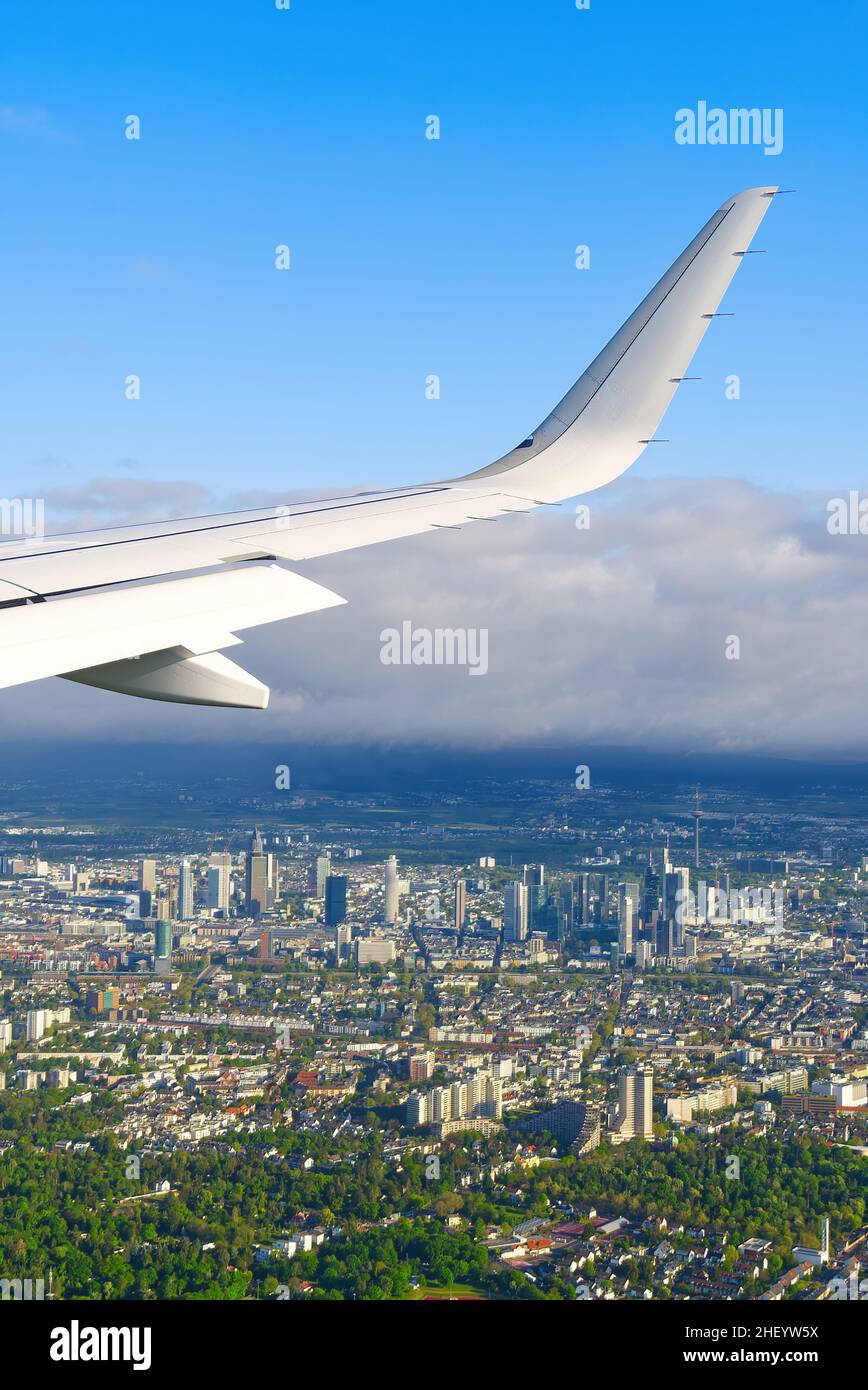 View of airplane white wing flying in blue sky over clouds Stock Photo ...