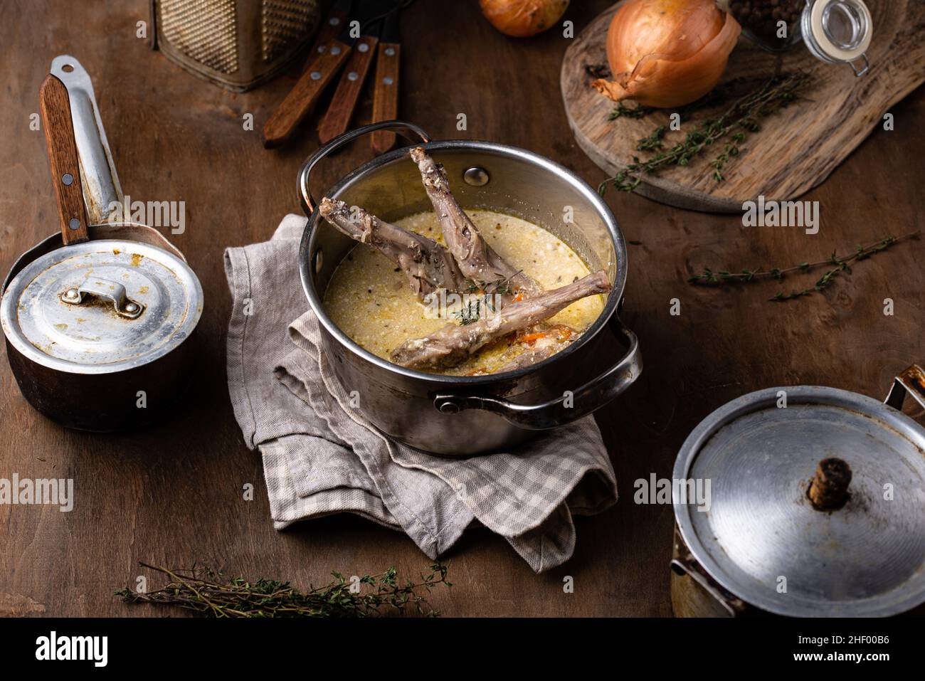 Stewed rabbit legs with sour cream Stock Photo