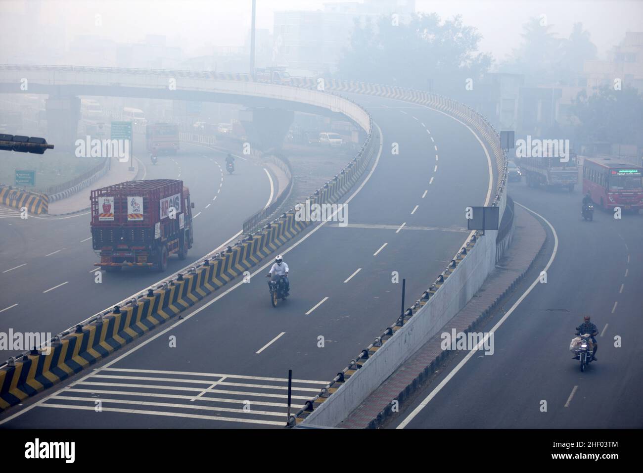 Chennai, Tamil Nadu, India. 13th Jan, 2022. The city was seen enveloped with severe smog as a result of the Bhogi Bonfire in Chennai. Bhogi is the first day of the four-day Makara Sankranti festival. On Bhogi, people discard old and derelict things and concentrate on new things causing change or transformation. People light bonfires with logs of wood, old clothes, and wooden furniture at home that are no longer useful. (Credit Image: © Sri Loganathan/ZUMA Press Wire) Stock Photo