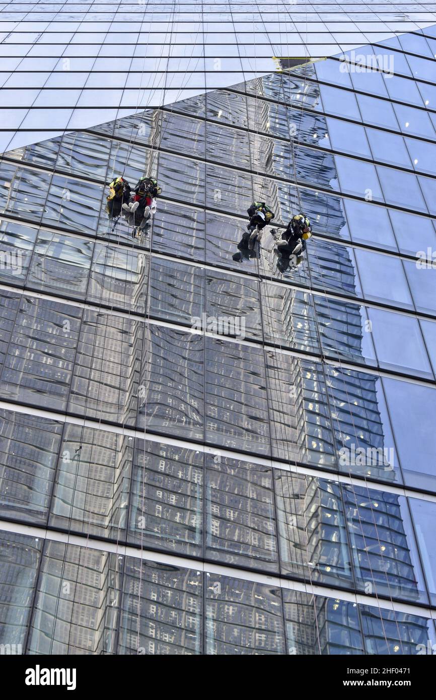 workers-cleaning-glass-facade-of-modern-skyscraper-in-city-of-london-uk-stock-photo-alamy