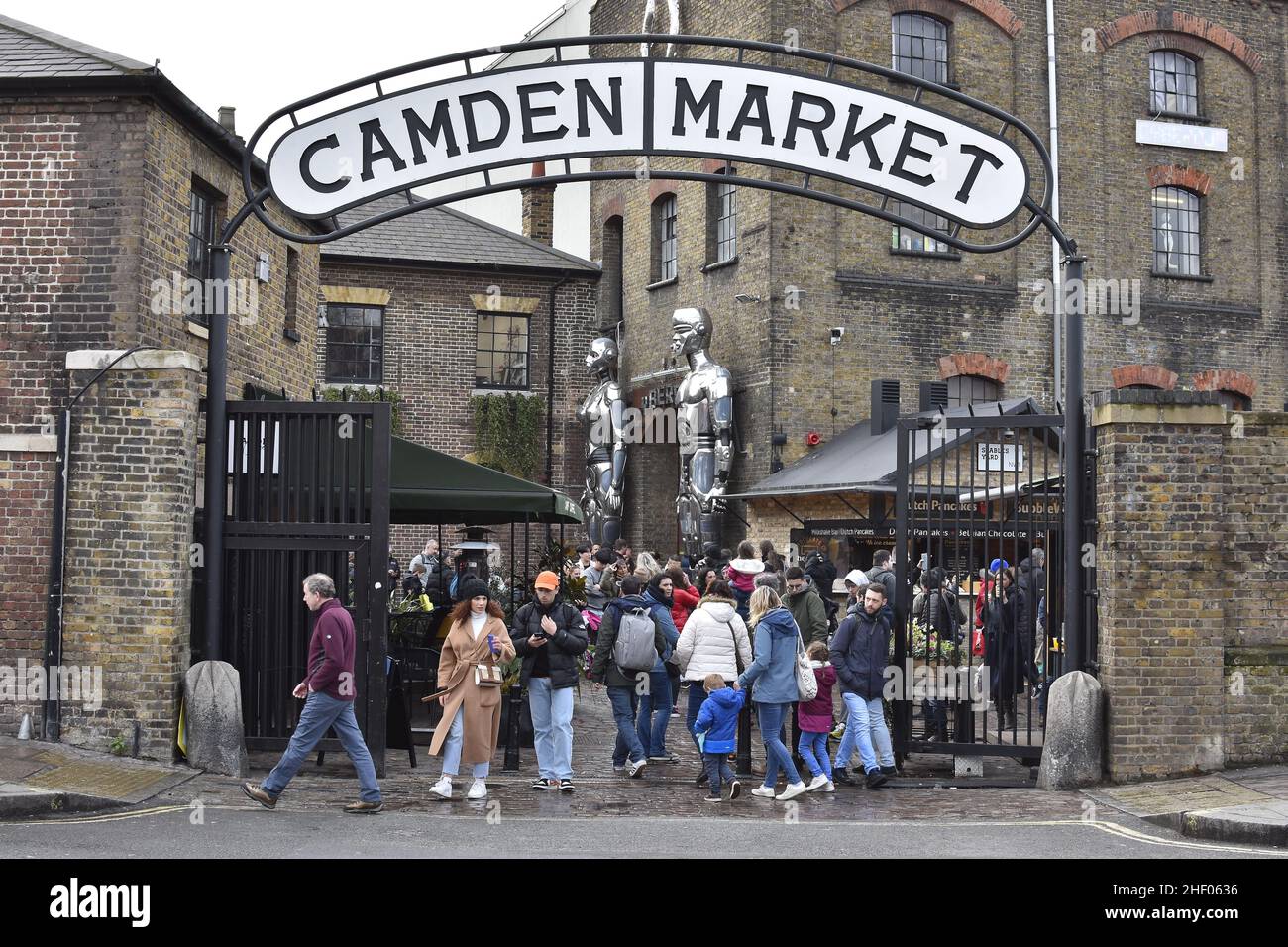 Camden Market gate entrance, shoppers in Camden Town London UK. Stock Photo