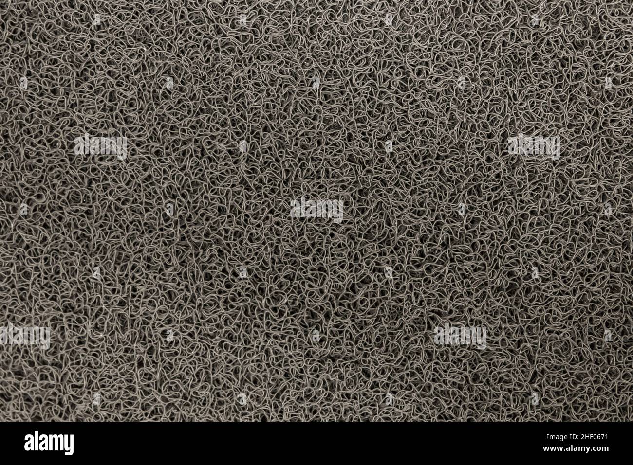 Dark carpet rough texture surface with abstract background black pattern. Stock Photo