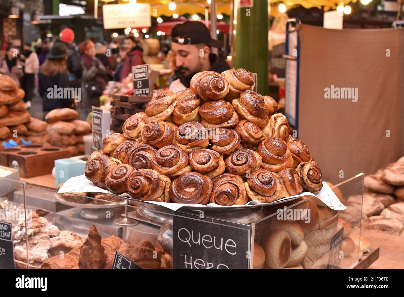 Cinnamon buns and other baked product displayed at Borough market in Southwark London UK. Stock Photo
