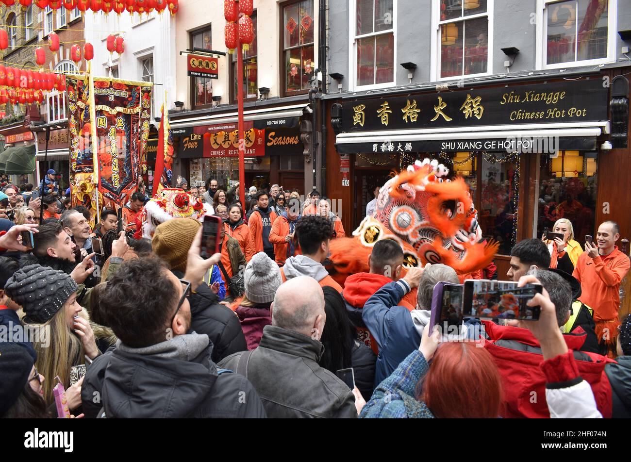 Crowded street of Chinatown, people celebrating Chinese New Year 2020 in London UK. Stock Photo