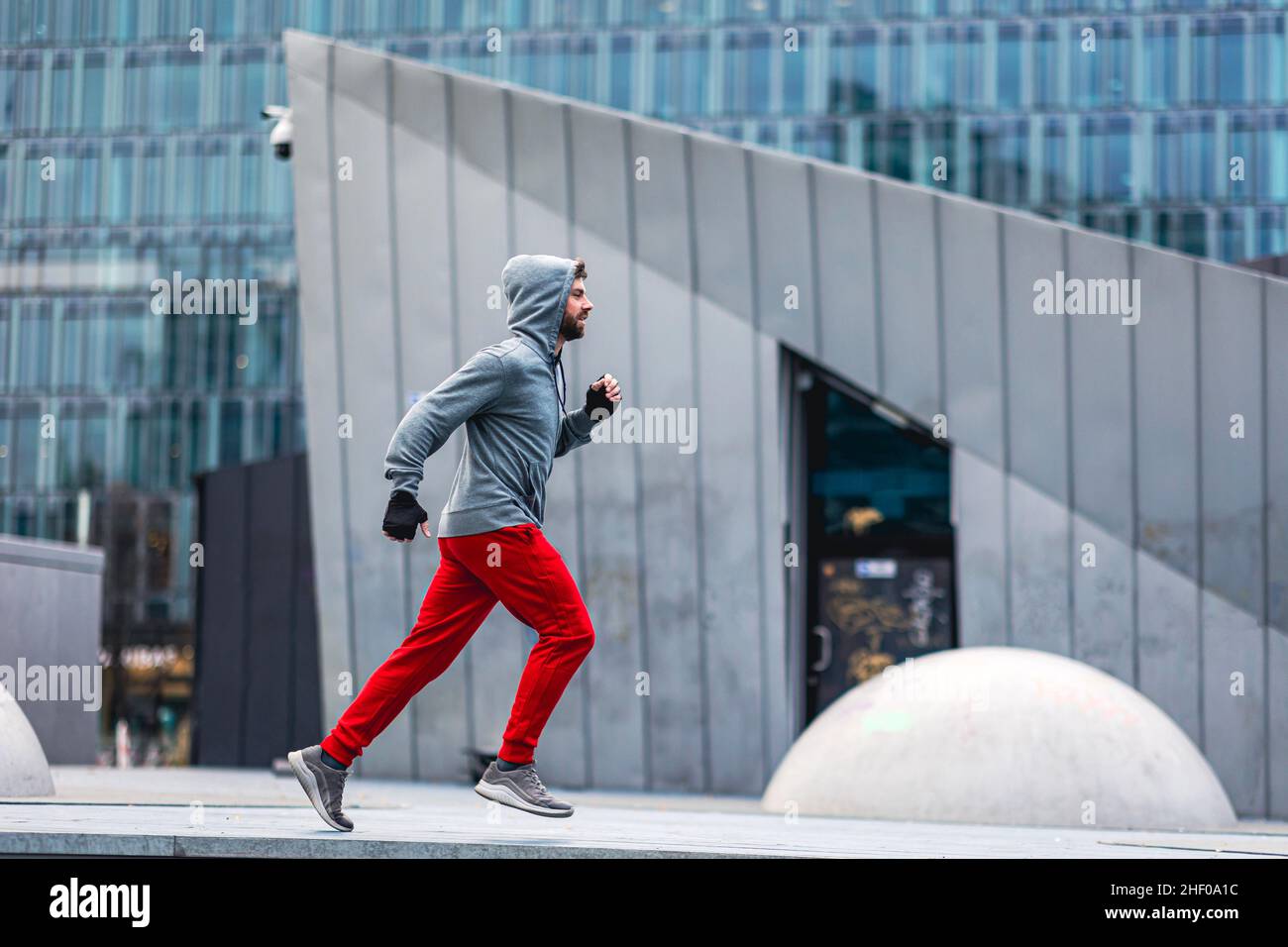 Young man running in the city Stock Photo